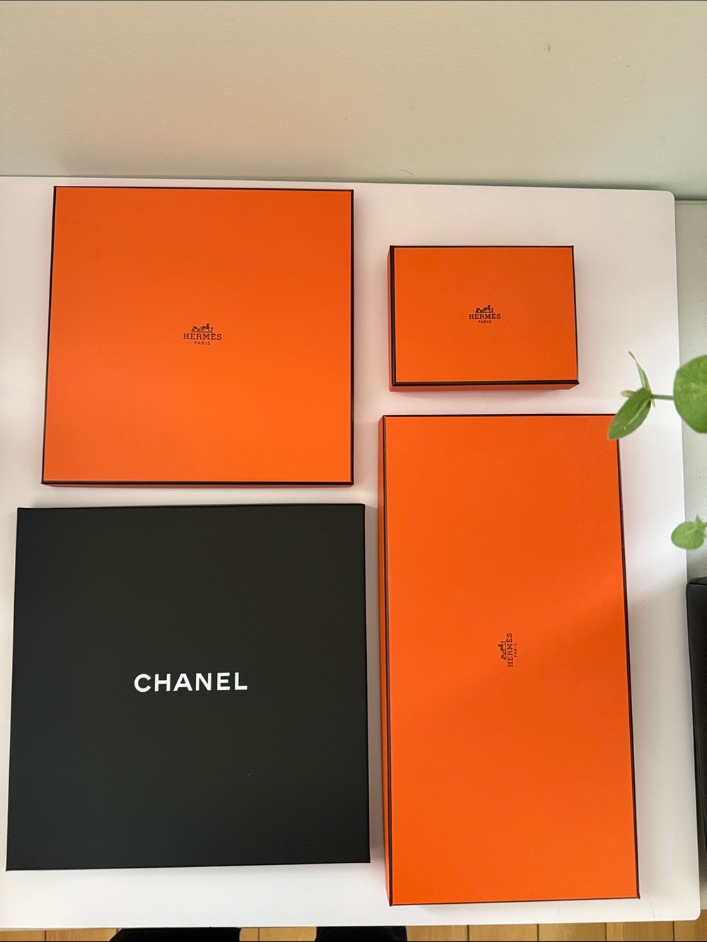 Chanel and Hermes gift boxes.
